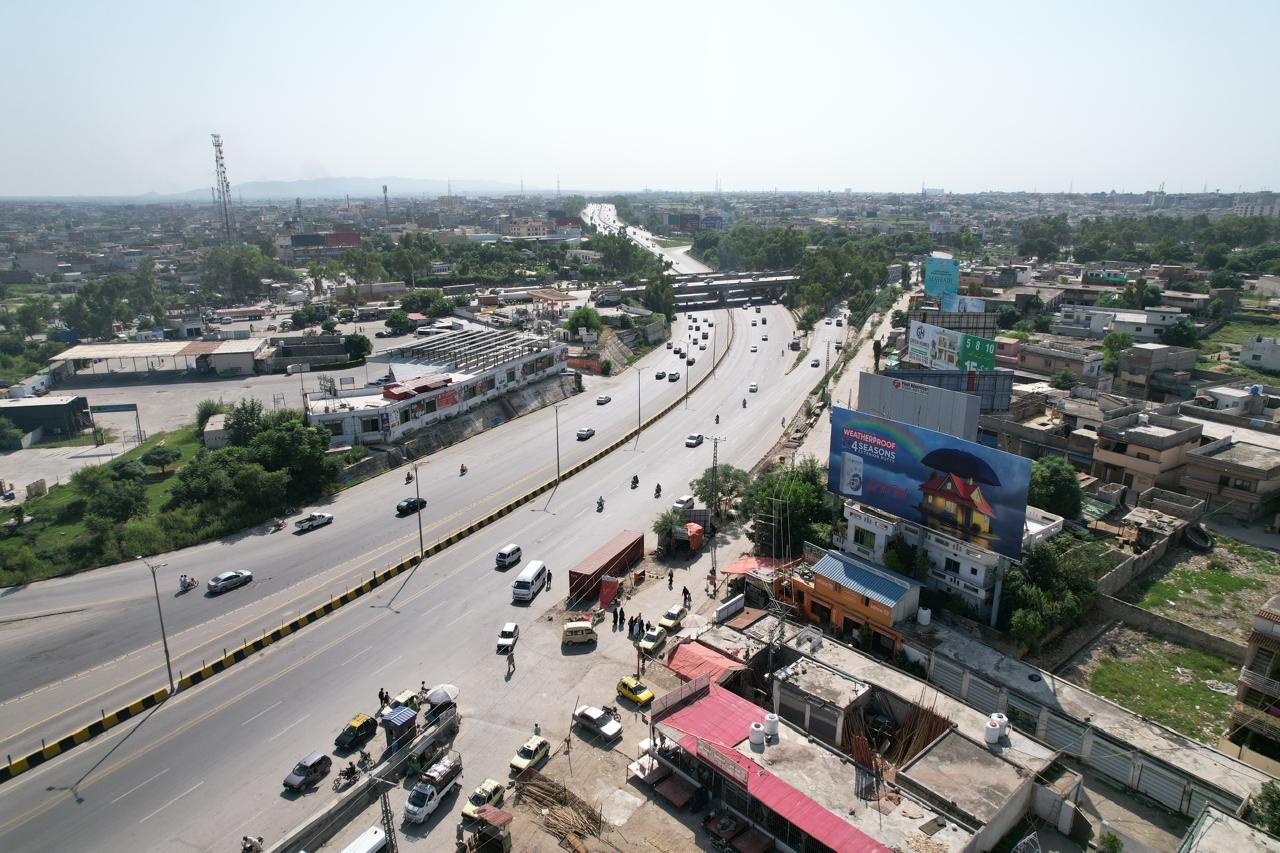 Billboard on busy road with city view